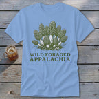 Light blue t-shirt with a green illustration of morel mushrooms and text.
