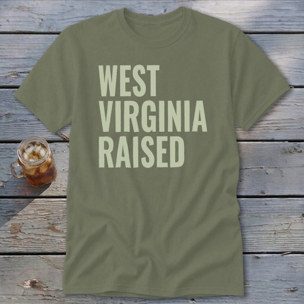 Olive green t-shirt with "West Virginia Raised" printed in pale yellow text.