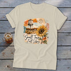 T-shirt with "Small Town Fall Vibes" text, water tower, and sunflower graphic.