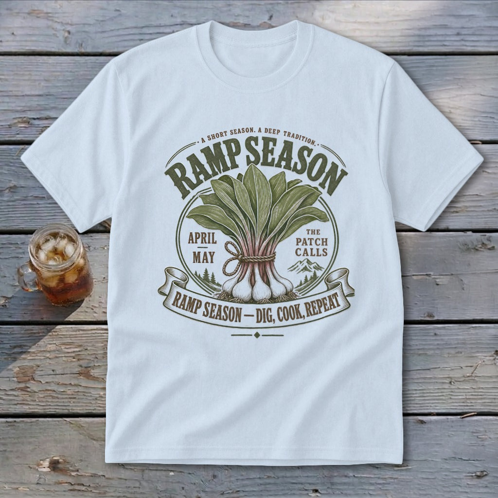 White t-shirt with RAMP SEASON graphic featuring ramps, mountains, and text.