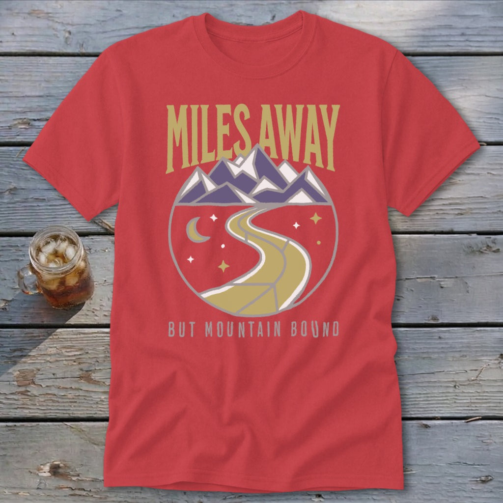 Red t-shirt with "MILES AWAY BUT MOUNTAIN BOUND" text and mountain graphic.