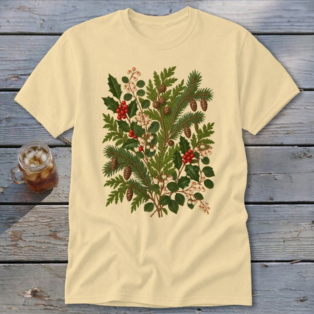 Light yellow t-shirt with a detailed illustration of pine branches, holly, and pinecones.