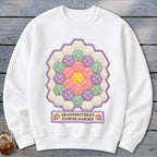 White sweatshirt with hexagonal patchwork "Grandmother's Flower Garden" design.