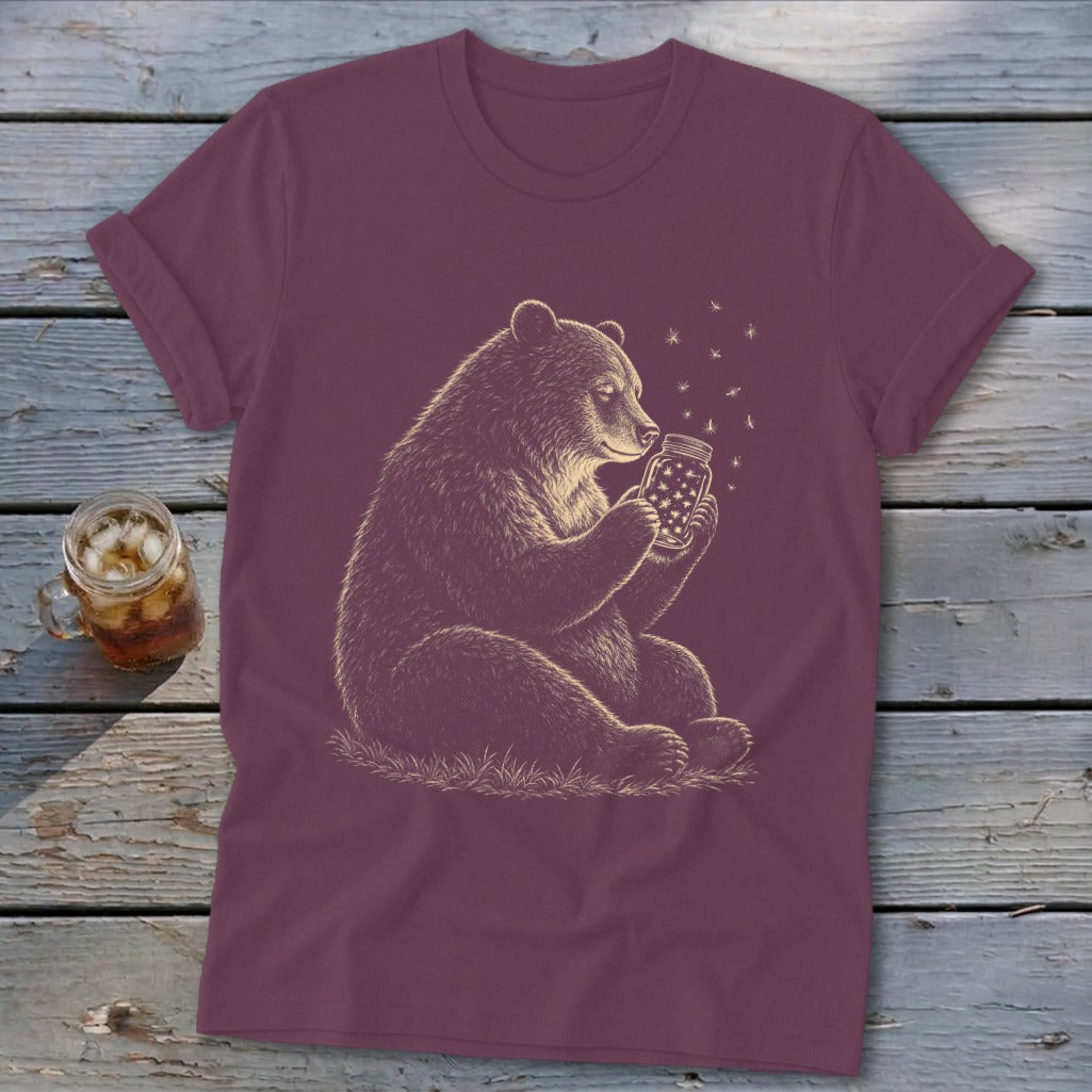 Bear holding a mason jar filled with stars, with fireflies floating around.