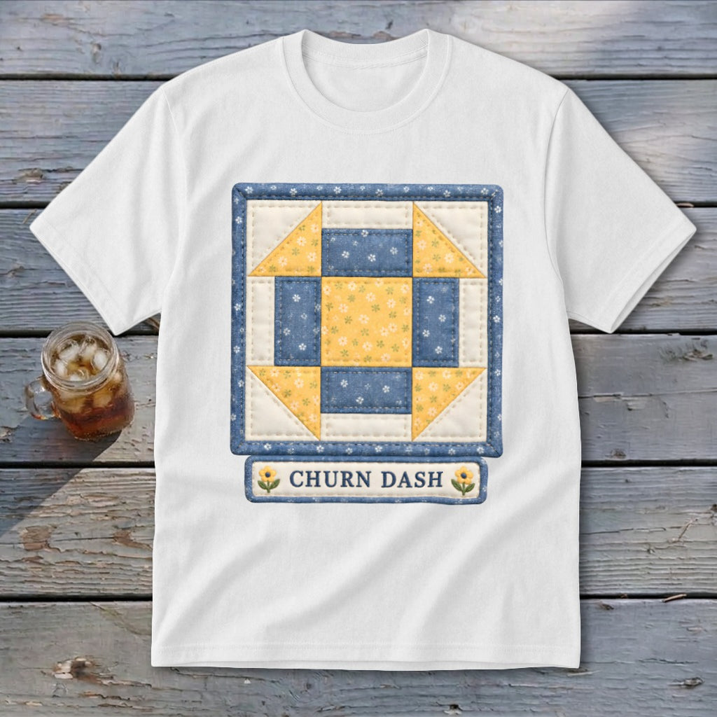 White t-shirt with a blue and yellow quilt block design and "CHURN DASH" text.