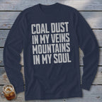 A dark blue long-sleeved shirt with white distressed text reading COAL DUST IN MY VEINS MOUNTAINS IN MY SOUL.