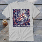 White t-shirt featuring a ghost in a forest and the text "The Haints Ain't Left".
