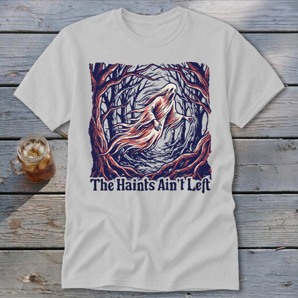 White t-shirt featuring a ghost in a forest and the text "The Haints Ain't Left".