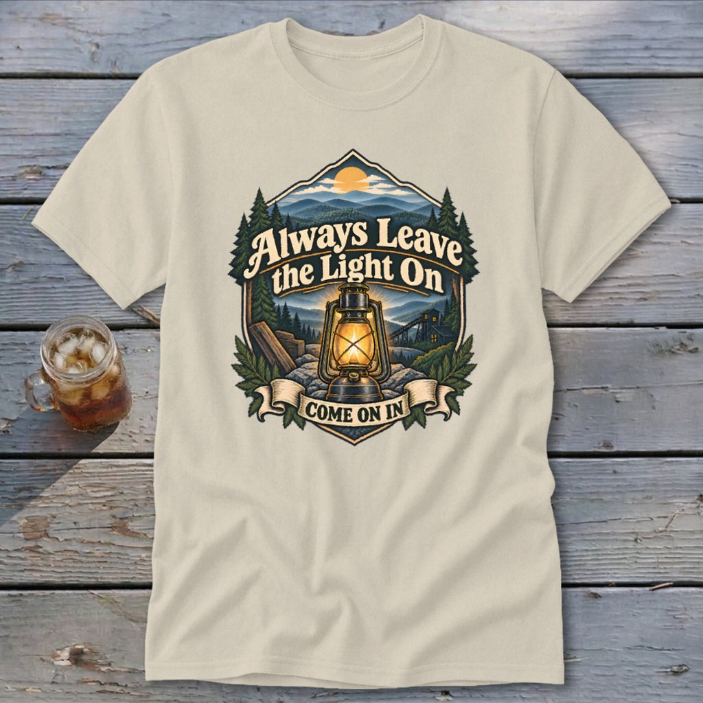T-shirt graphic: "Always Leave the Light On Come On In" with lantern and mountains.