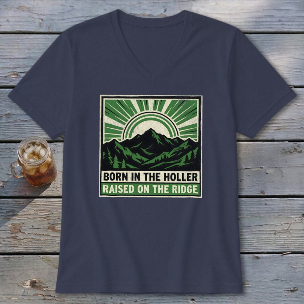 Dark blue V-neck t-shirt featuring a green and black mountain graphic with the text Born in the Holler Raised on the Ridge.
