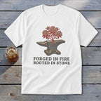 White t-shirt with anvil graphic and text "Forged in Fire Rooted in Stone".