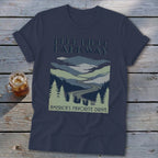 Dark blue t-shirt featuring a Blue Ridge Parkway graphic with mountains, winding road, and pine trees.