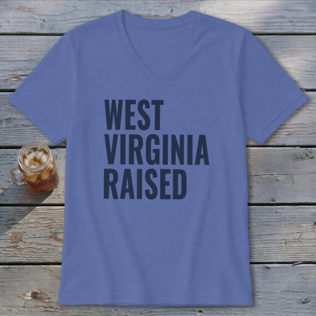 Blue v-neck t-shirt with "WEST VIRGINIA RAISED" text in dark blue.