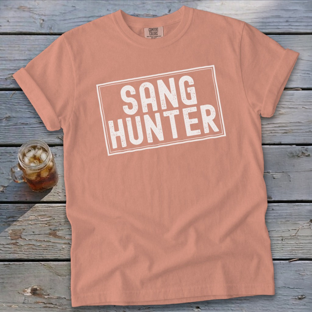 Peach t-shirt with white "SANG HUNTER" text inside a distressed rectangle.