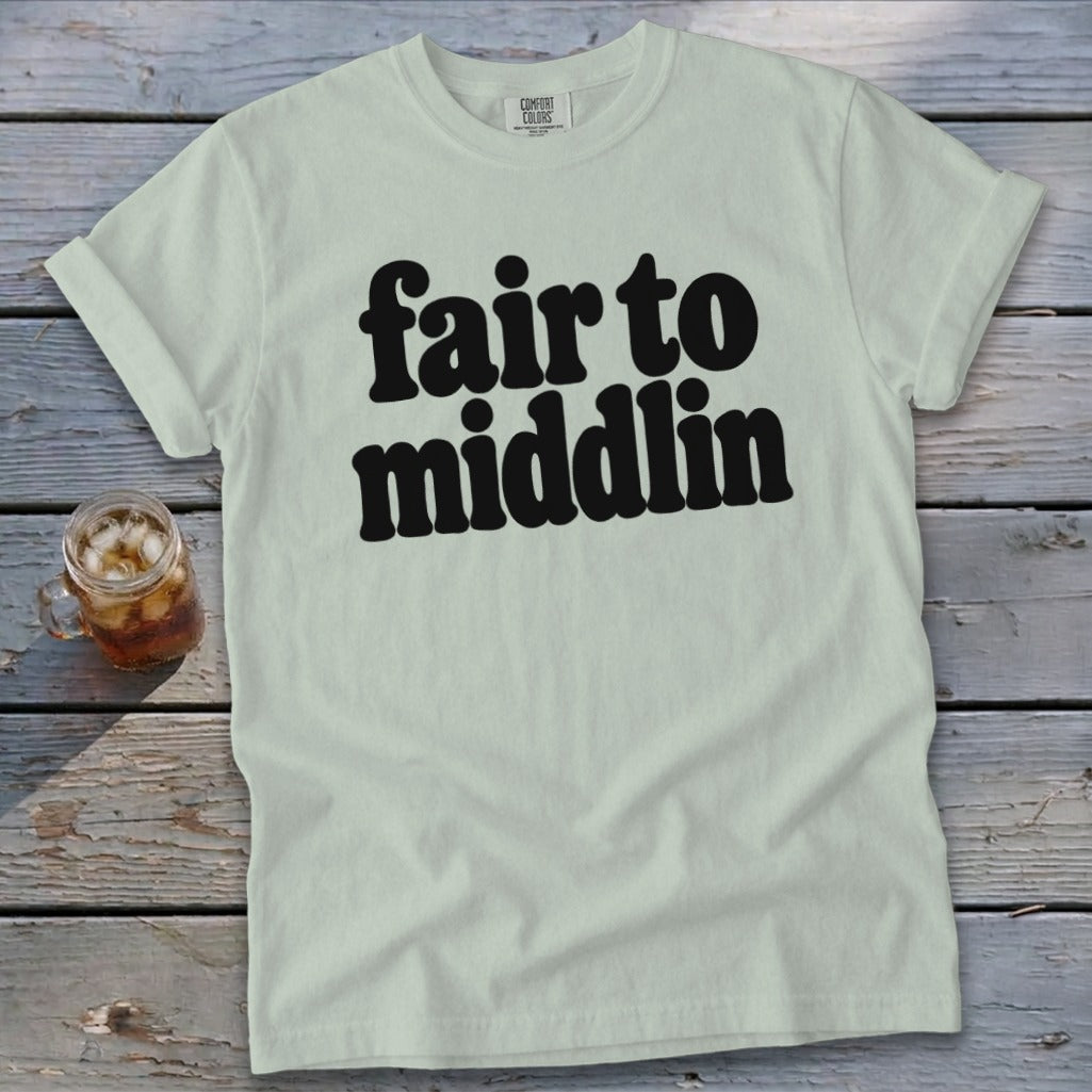 Light green Comfort Colors t-shirt with black text reading "fair to middlin".