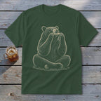 Green t-shirt with a drawing of a bear sitting and playing a harmonica.