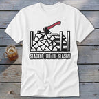 White t-shirt with graphic of stacked firewood, an axe, and text "STACKED FOR THE SEASON."
