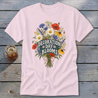 Pink t-shirt with a floral bouquet graphic that reads "Decoration Day Blooms".