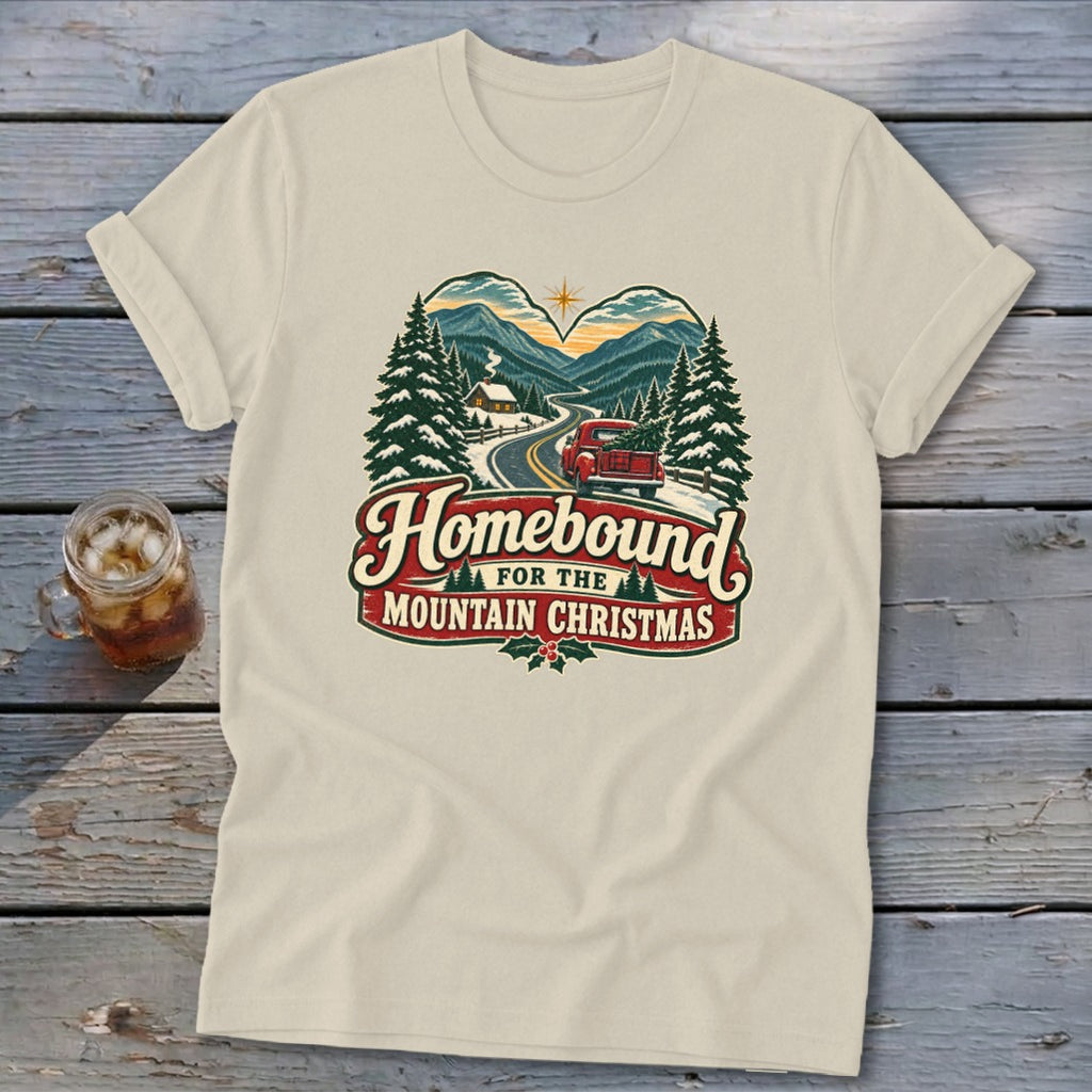 Shirt with "Homebound for the Mountain Christmas" text and vintage truck scene.