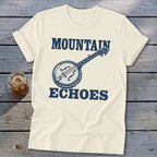 Off-white crewneck t-shirt with blue graphic of a banjo and the words MOUNTAIN ECHOES.