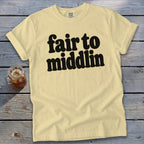 Light yellow t-shirt with black text "fair to middlin" and a glass of iced tea.