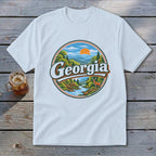 White t-shirt with a circular Georgia graphic featuring mountains, a river, and a deer.