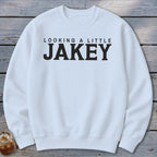 White sweatshirt with "LOOKING A LITTLE JAKEY" text.