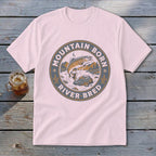 Pink t-shirt with "Mountain Born River Bred" circular graphic featuring a leaping fish.