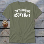An olive green t-shirt with white text that reads This Thanksgiving Is Sponsored By Soup Beans.