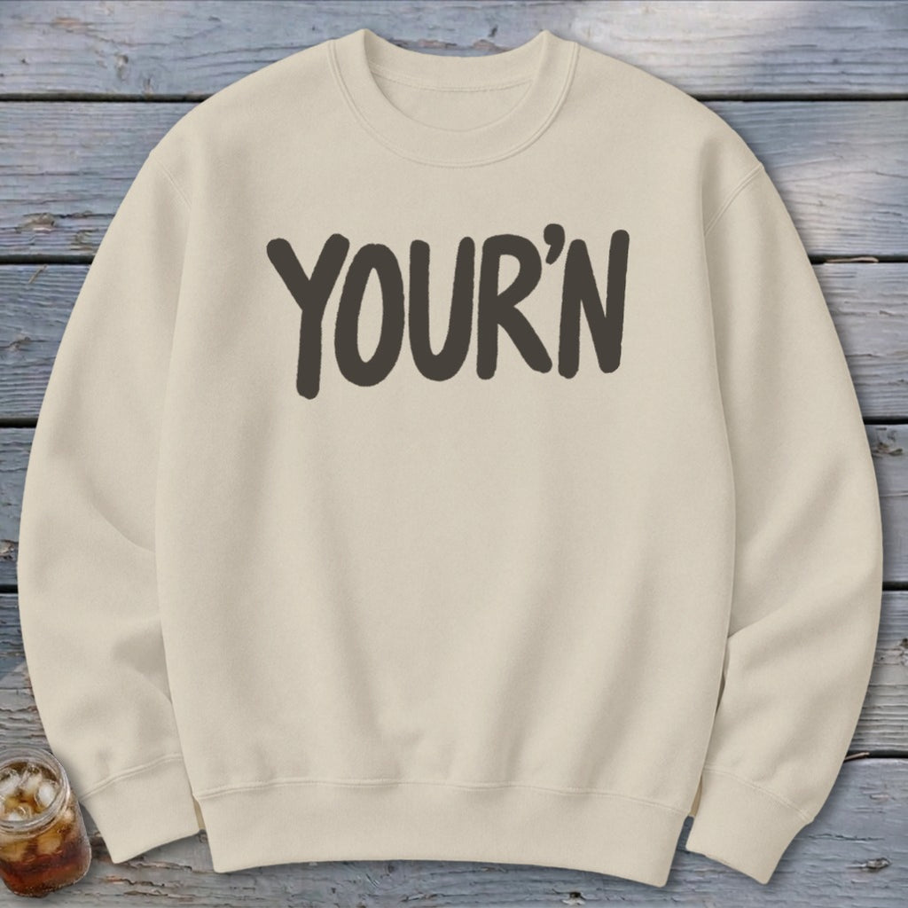 Cream sweatshirt with "YOUR'N" printed in dark gray on the chest.