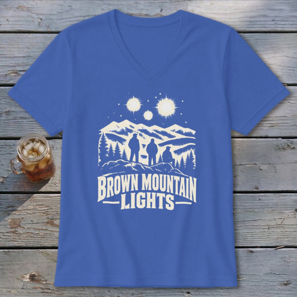Blue V-neck t-shirt featuring a graphic of three hikers looking at glowing mountain lights.
