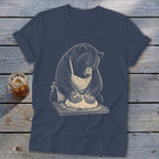 Bear wearing apron kneading dough on a wooden cutting board graphic on a t-shirt.