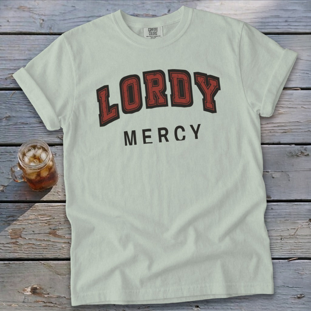 Light blue t-shirt with "LORDY MERCY" printed in red and black lettering.