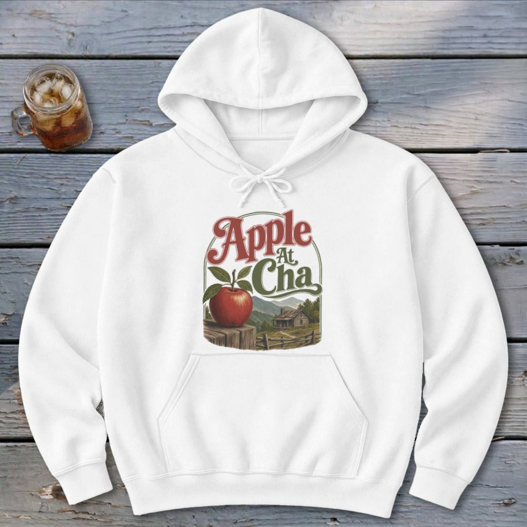 A white pullover hoodie with a graphic of an apple on a fence and text reading Apple At Cha.