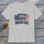 Light gray V-neck t-shirt featuring a distressed American flag design with the text Ohio Raised American Made.