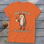 Orange t-shirt with possum graphic and text "DON'T MIND ME I'M JUST SULLED UP".