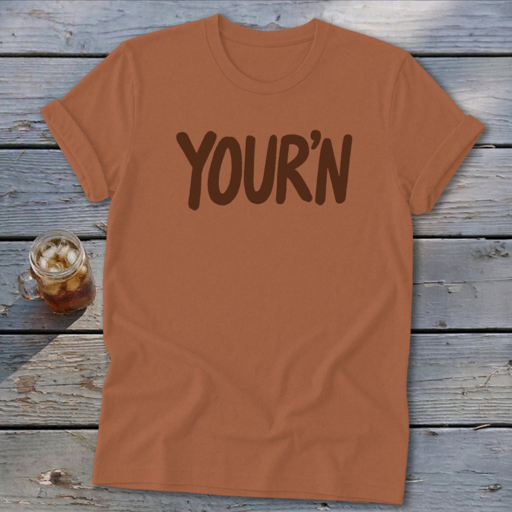 Brown t-shirt with "YOUR'N" printed in dark brown text.