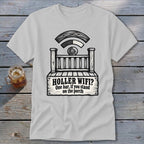 A light gray t-shirt featuring a black graphic of a porch, Wi-Fi symbol, and text reading HOLLER WIFI? One bar, if you stand on the porch.
