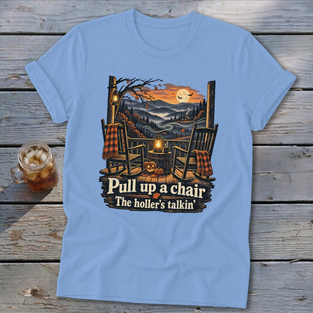 Light blue t-shirt with rocking chairs on a porch and "Pull up a chair The holler's talkin'" text.