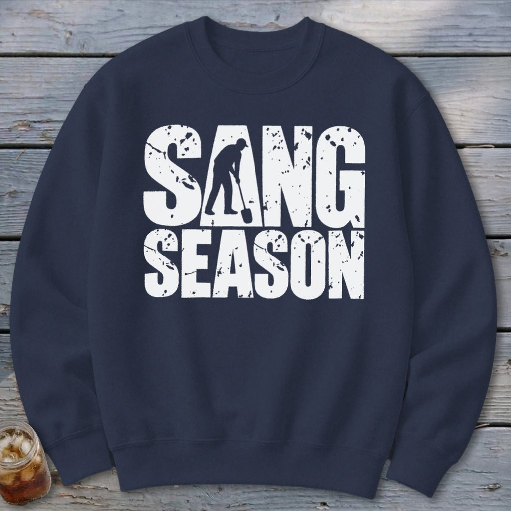 Dark blue crewneck sweatshirt featuring white distressed text reading SANG SEASON with a digger silhouette.