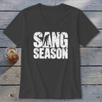 A dark gray V-neck t-shirt with distressed white text reading SANG SEASON and a graphic of a person digging.