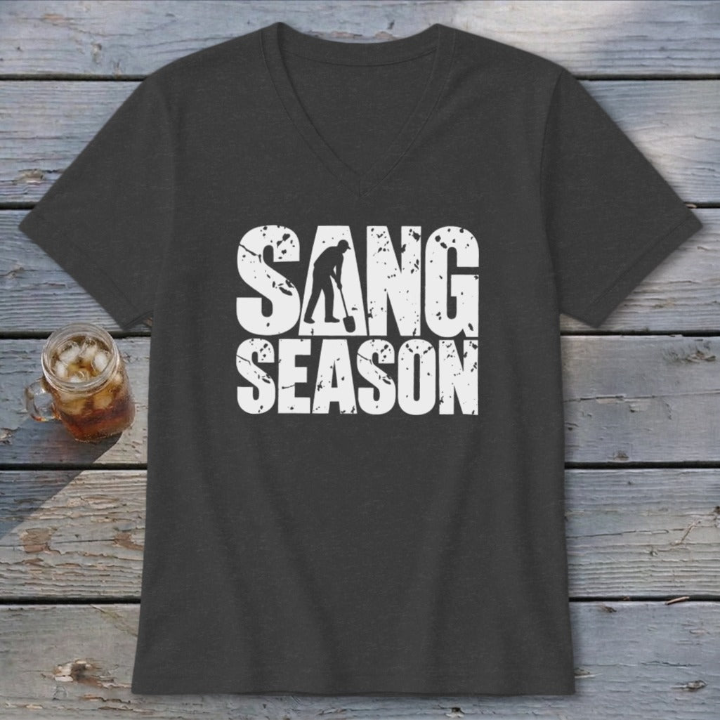 A dark gray V-neck t-shirt with distressed white text reading SANG SEASON and a graphic of a person digging.
