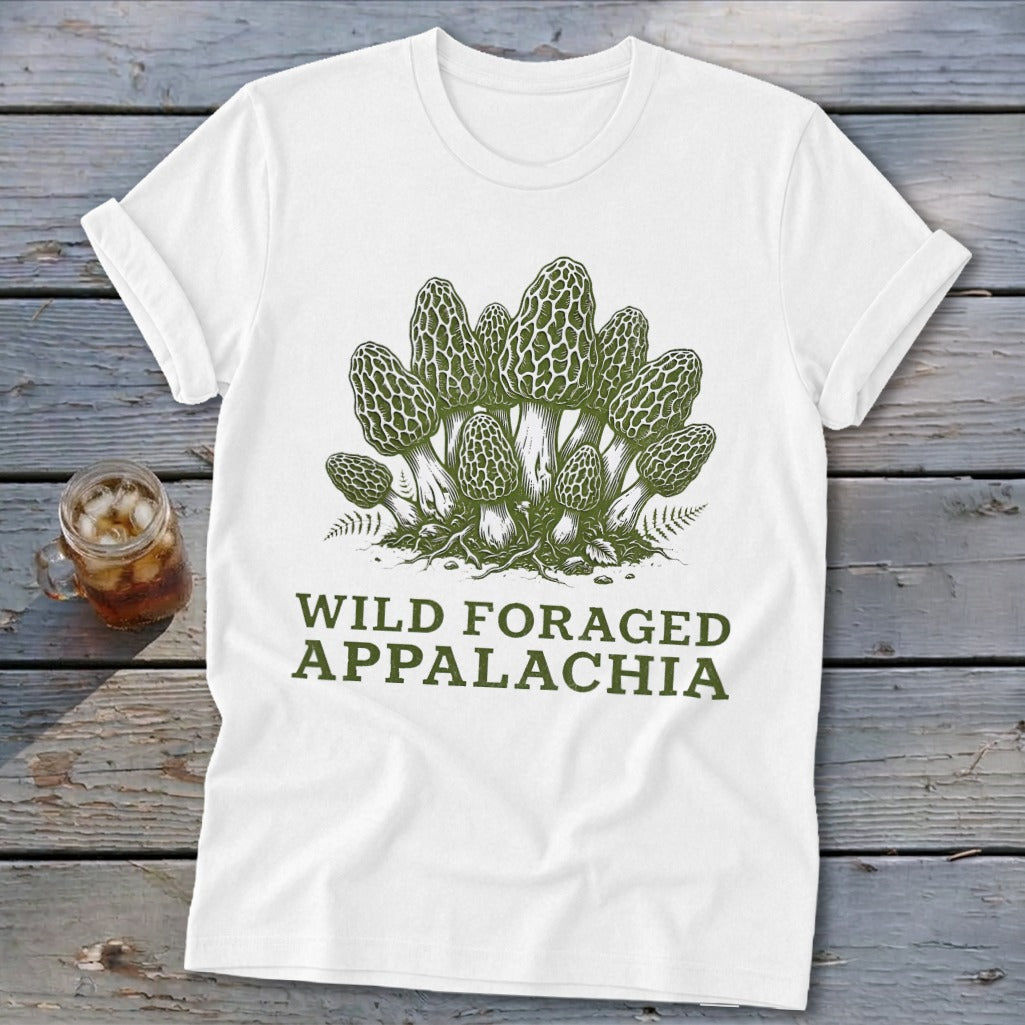 White t-shirt with green graphic of morel mushrooms and text "WILD FORAGED APPALACHIA".