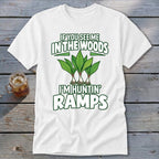 A white t-shirt features green text reading "IF YOU SEE ME IN THE WOODS I'M HUNTIN' RAMPS" above and below an illustration of three ramps.