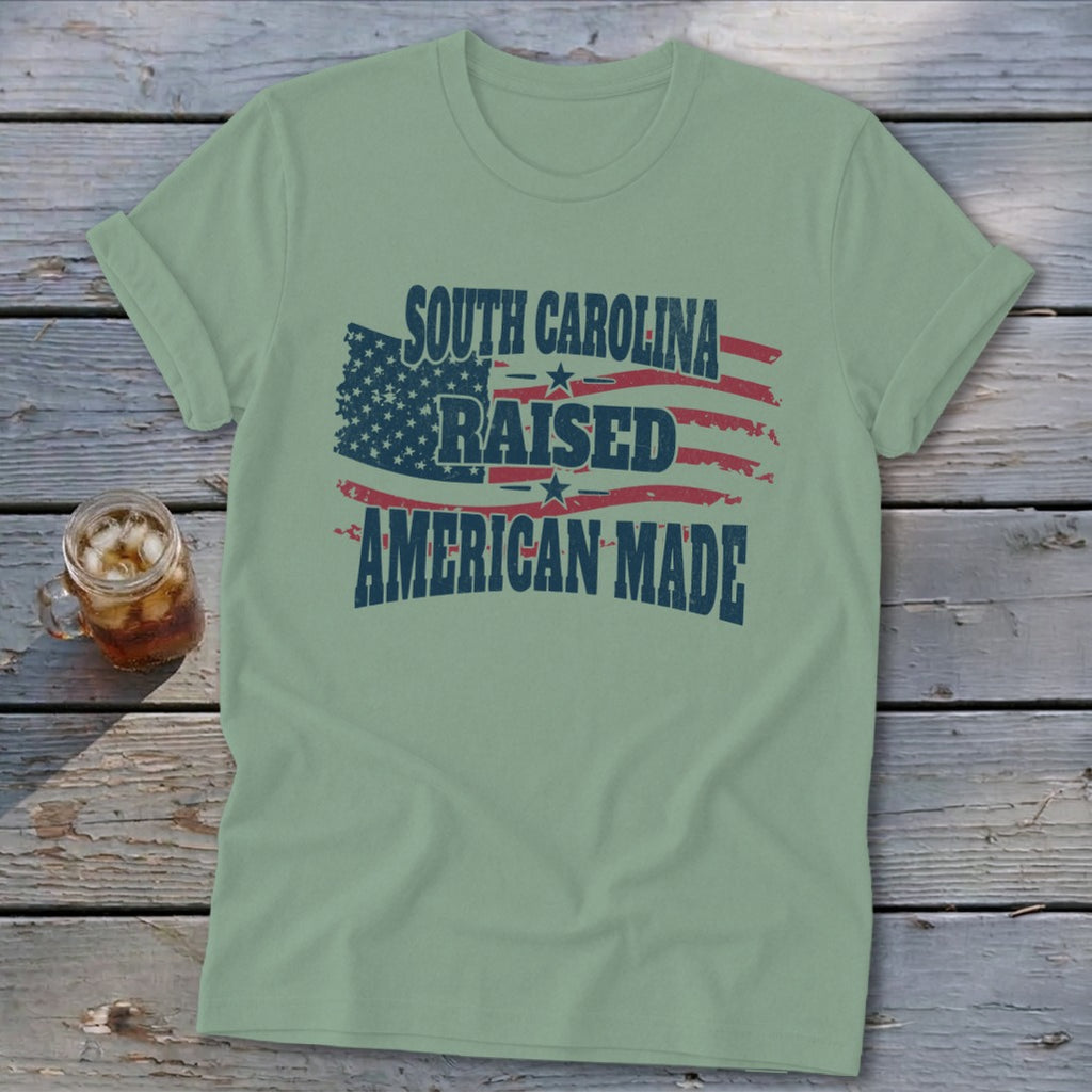 T-shirt with South Carolina Raised American Made text over an American flag design.