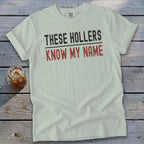 Light green t-shirt with text "THESE HOLLERS KNOW MY NAME".