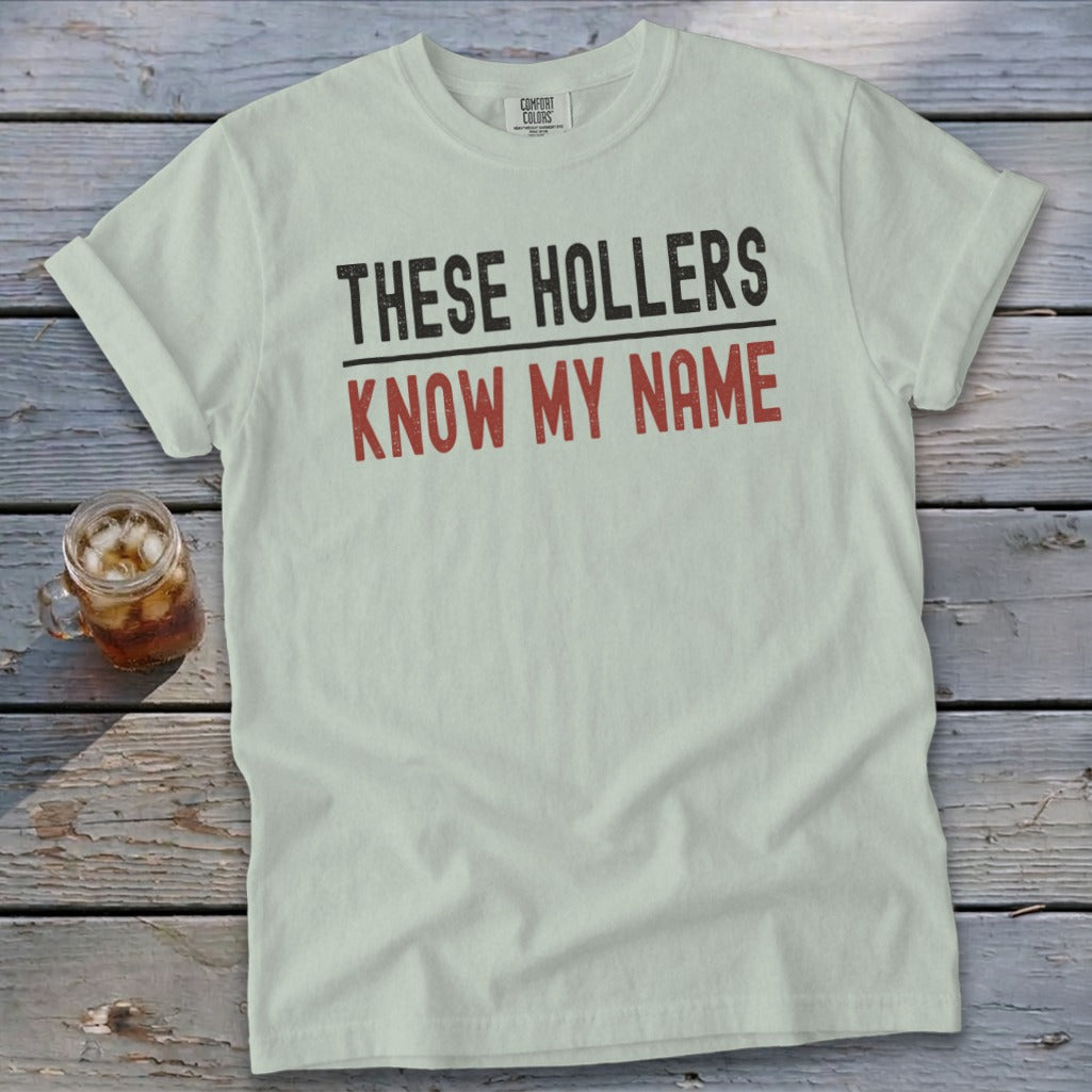 Light green t-shirt with text "THESE HOLLERS KNOW MY NAME".