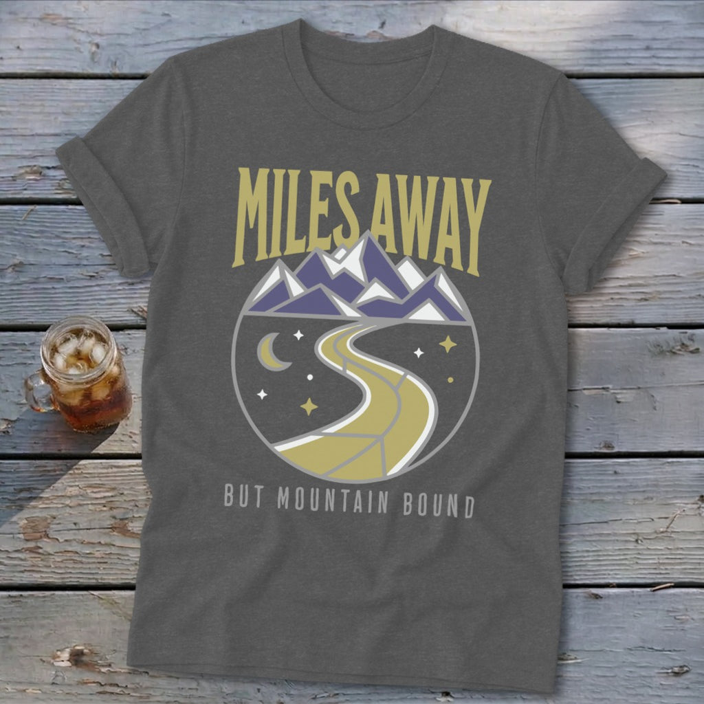 Gray t-shirt with "MILES AWAY BUT MOUNTAIN BOUND" text and mountain landscape graphic.