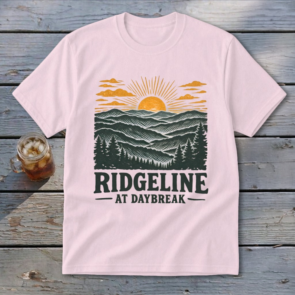 Pink t-shirt with a Ridgeline at Daybreak mountain sunset graphic and text.
