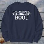 Navy sweatshirt with white text: "Colder Than A Welldigger's Boot".